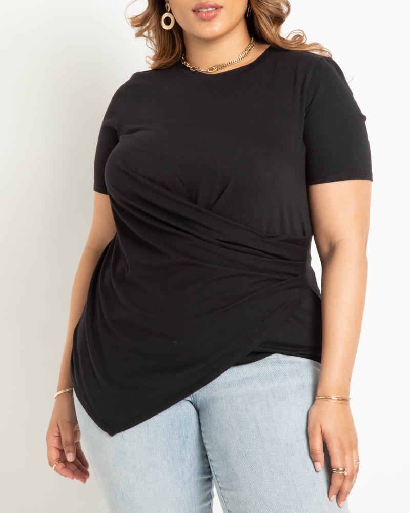 Front of a model wearing a size 14|16 Draped Tee With Asym Hem in Black by ELOQUII. | dia_product_style_image_id:284405